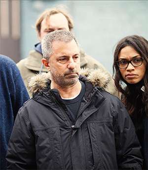Glen on set with actor Rosario Dawson